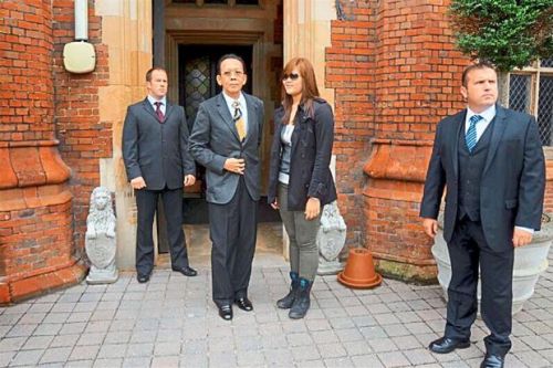 Pioneer spirit: Khoo (centre) and his daughter Niho visiting a London-based security training company.