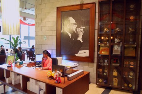 The entrance and reception of Leo Burnett featuring a potrait of the founding father, Leo Burnett himself, along with awards secured by the agency.