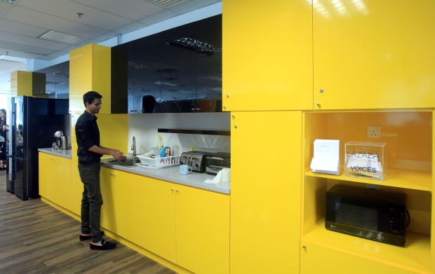 This dazzling yellow pantry adds a vibe of excitement and positivity to the workplace.